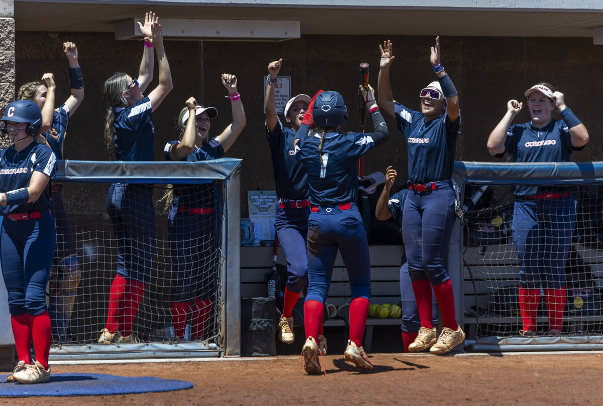 Coronado runner Bailey Goldberg (1) and teammates celebrate a score over Douglas during the sec ...