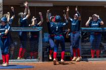 Coronado runner Bailey Goldberg (1) and teammates celebrate a score over Douglas during the sec ...