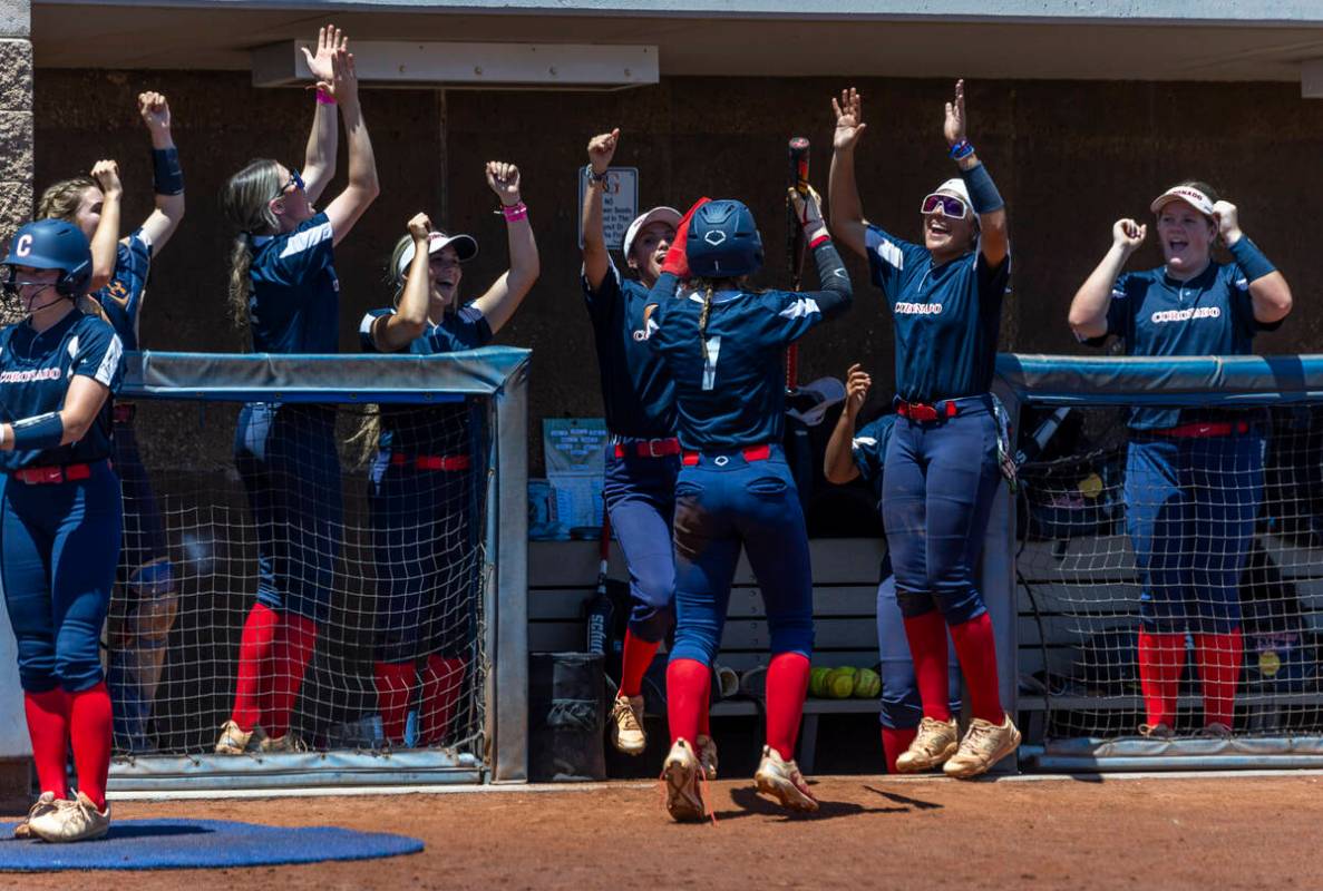 Coronado runner Bailey Goldberg (1) and teammates celebrate a score over Douglas during the sec ...