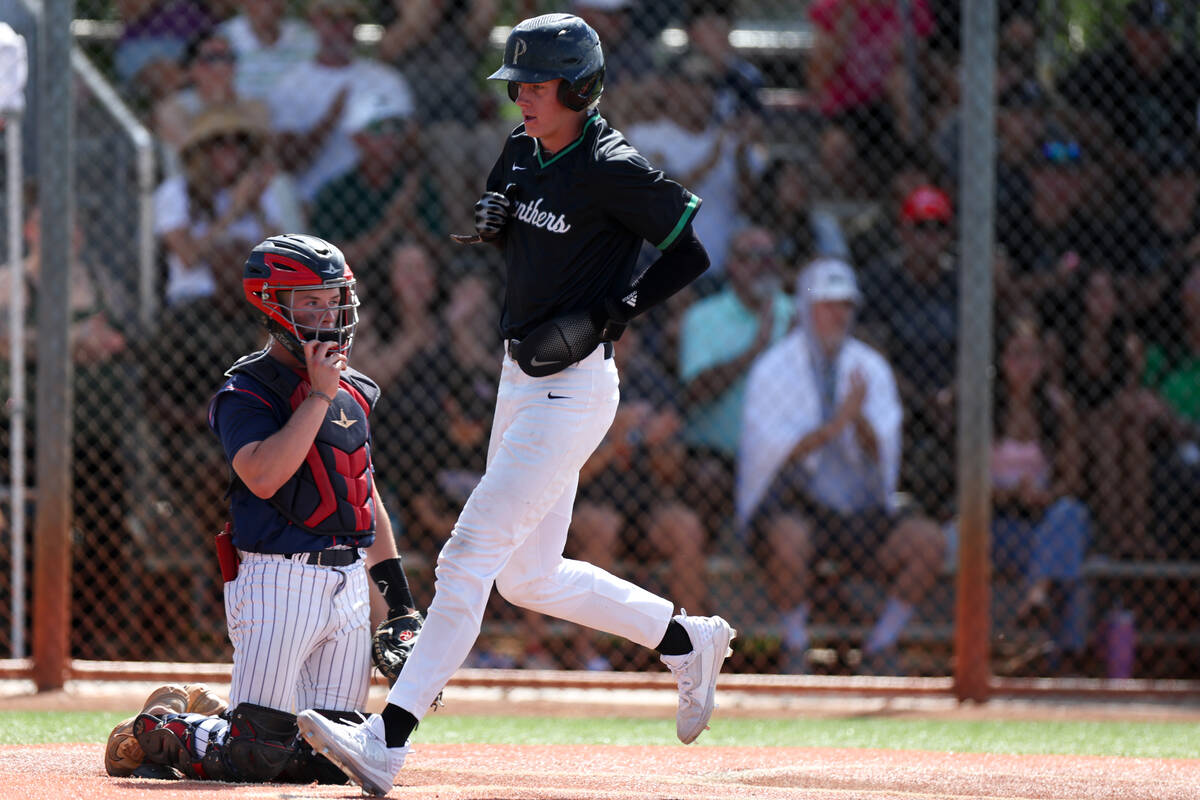 Palo Verde infielder Ethan Clauss (25) scores at home plate while Coronado catcher AJ Stalteri ...