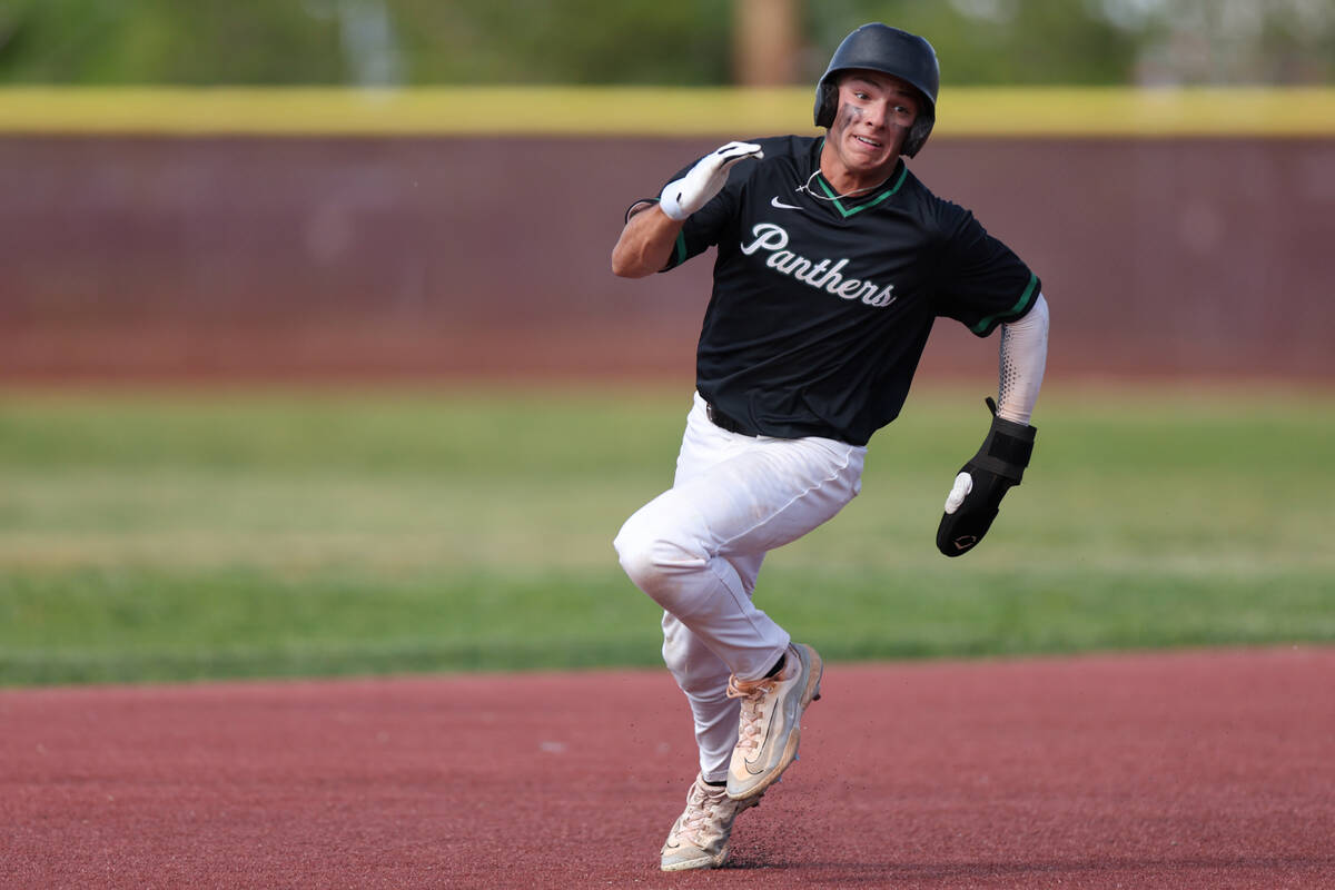 Palo Verde outfielder Karsen Smaka (6) sprints third base before scoring during a Class 5A base ...