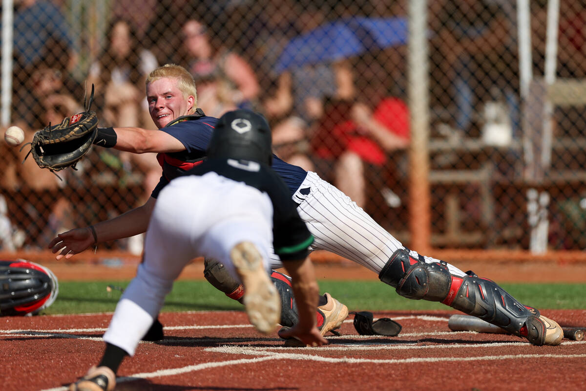 Coronado catcher AJ Stalteri (12) misses a catch while Palo Verde's Branson Pullan (3) slides i ...