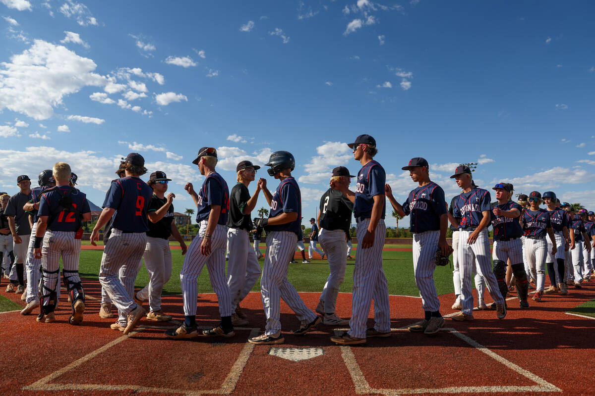 Palo Verde and Coronado bump fists after Palo Verde won a Class 5A baseball state tournament ga ...