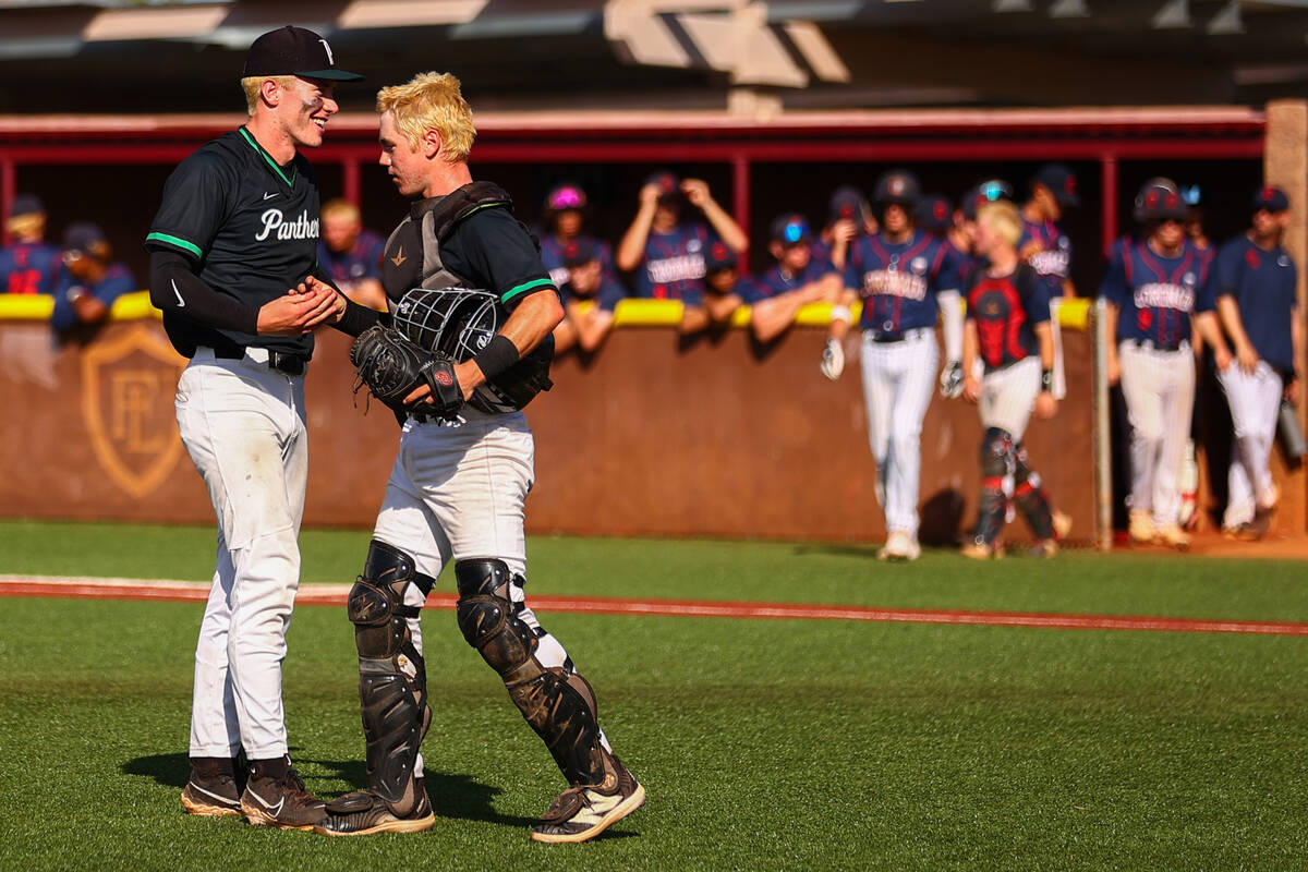 Palo Verde infielder Andrew Kaplan, left, and catcher Connor Rosinski shake hands after beating ...