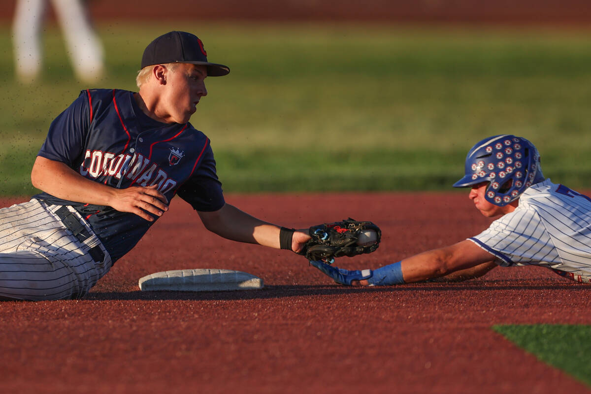 Coronado second baseman JacksonThomsen (7) attempts an out on Reno’s Logan Ford (7), who ...