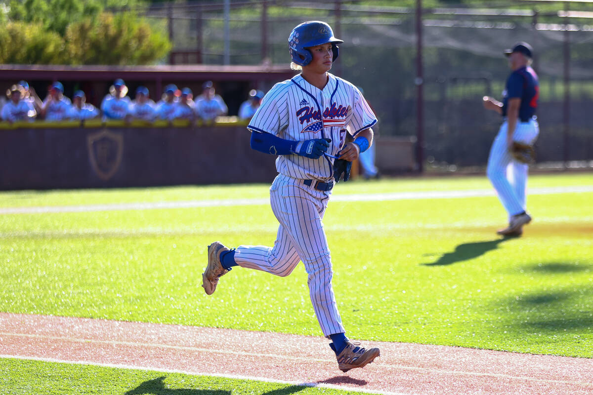 Reno’s Dawson Planeta runs to first base after being walked by Coronado during a Class 5 ...