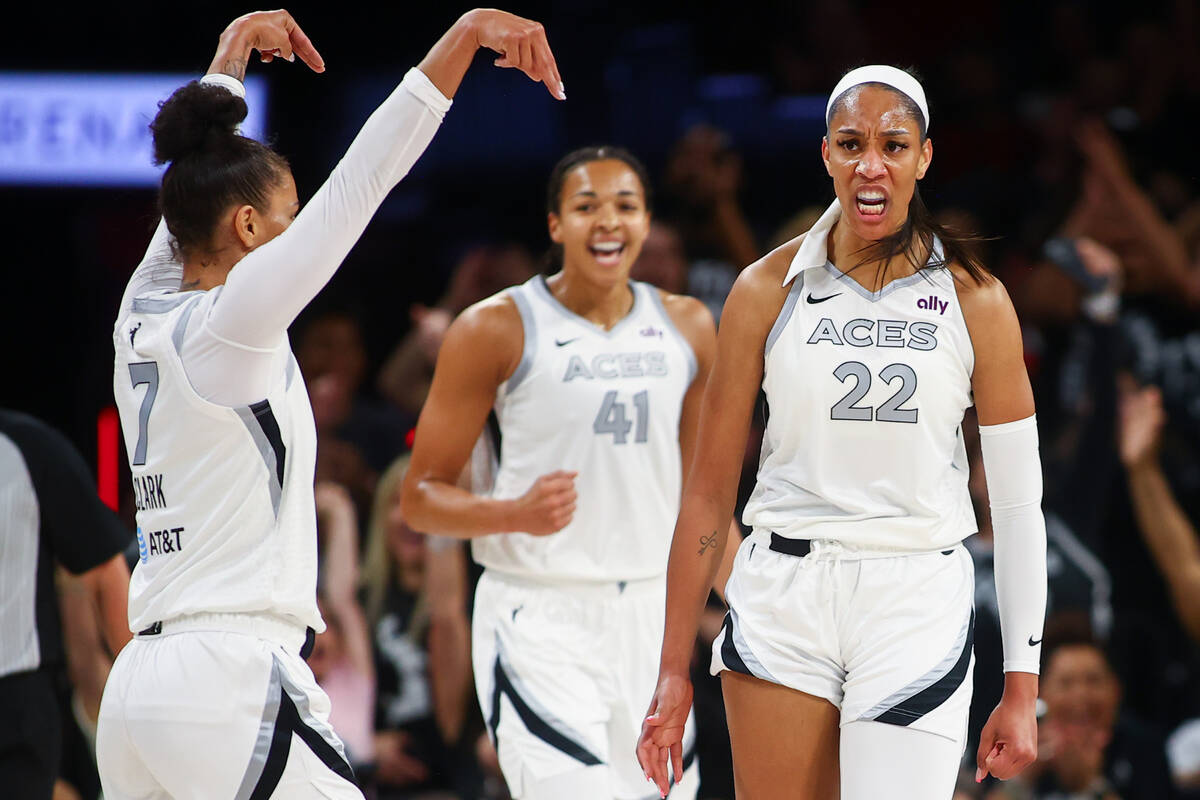 Las Vegas Aces center A'ja Wilson (22) celebrates with forward Alysha Clark (7) after scoring d ...