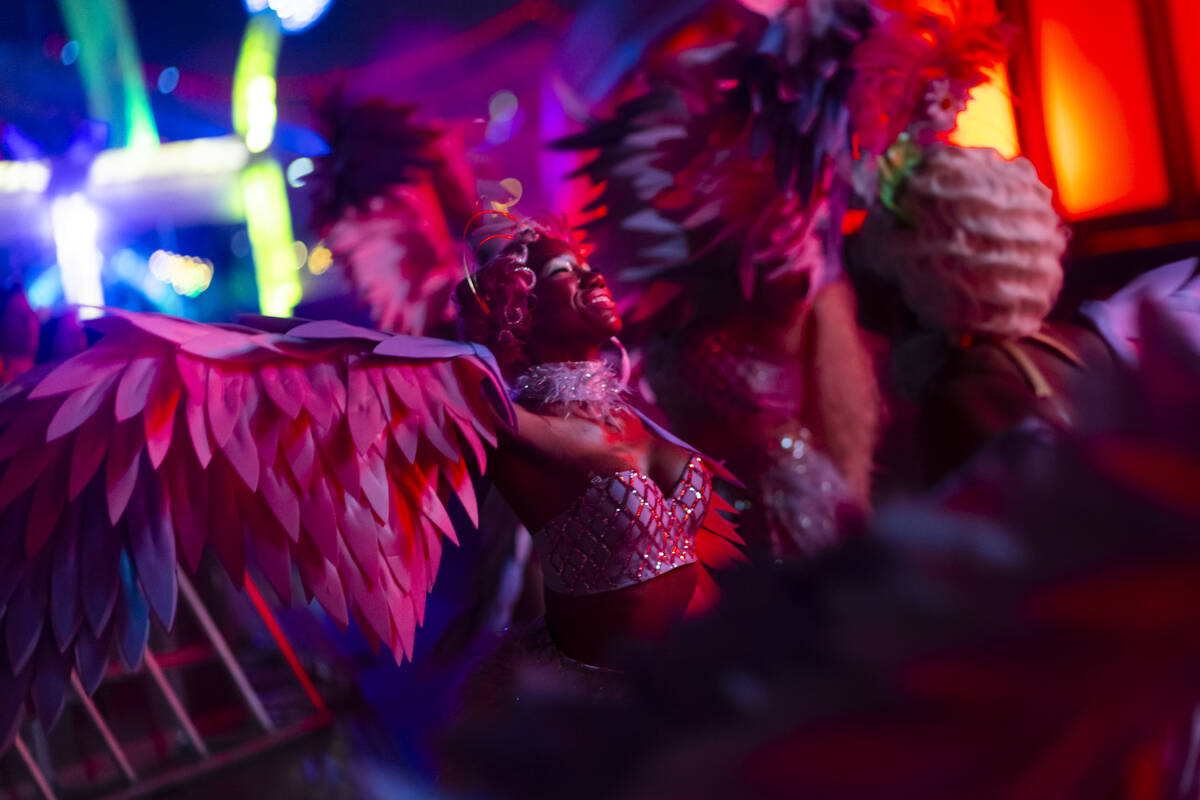 Costumed performers entertain the crowd at the Cosmic Meadow stage during the first night of th ...