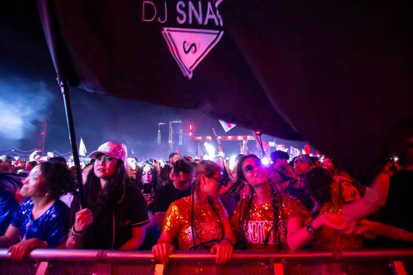 Festival attendees dance as DJ Snake performs at Kinetic Field during the second night of the E ...