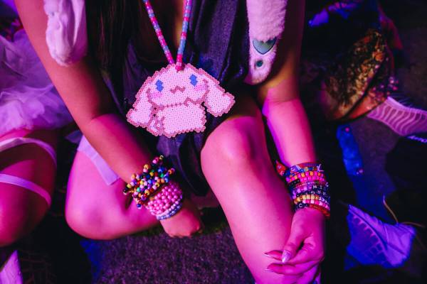 A festival attendee wears a beaded Cinnamoroll necklace on the third and final night of the Ele ...