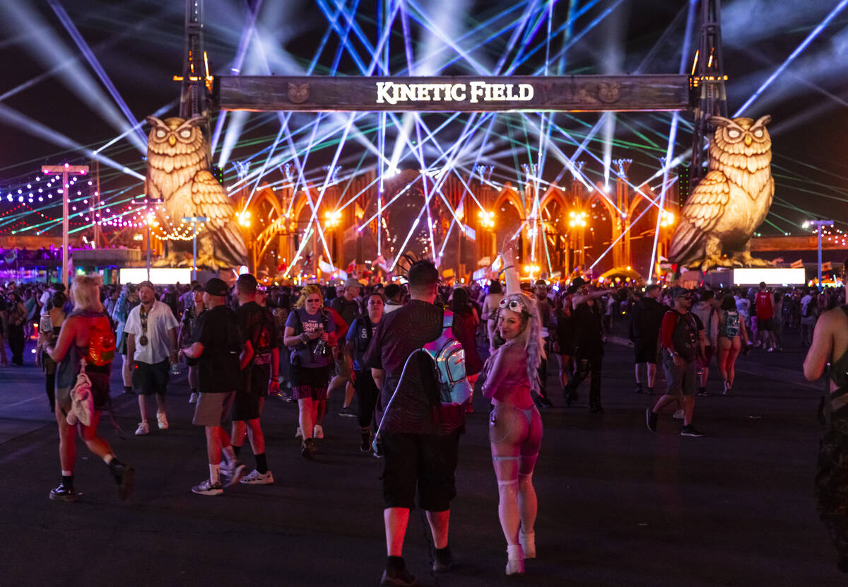 Festival attendee Rachel Hollon, of California, looks back while walking to Kinetic Field with ...
