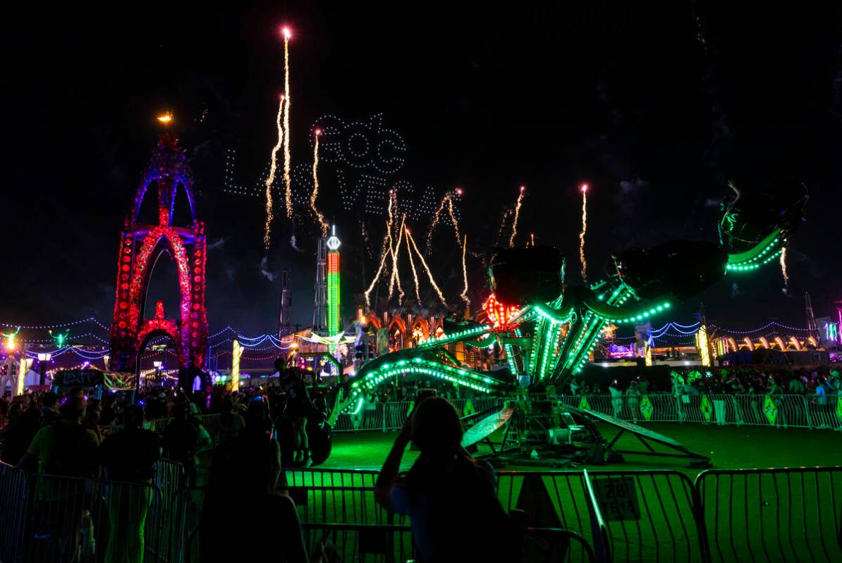 Fireworks and drones light up the sky during the third night of the Electric Daisy Carnival at ...