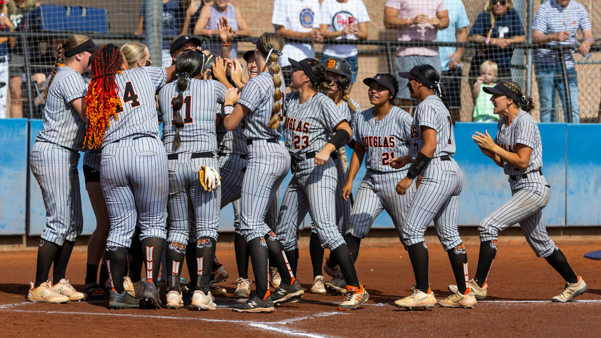 Douglas players celebrate a home run hit against Coronado during the first inning of their 5A s ...