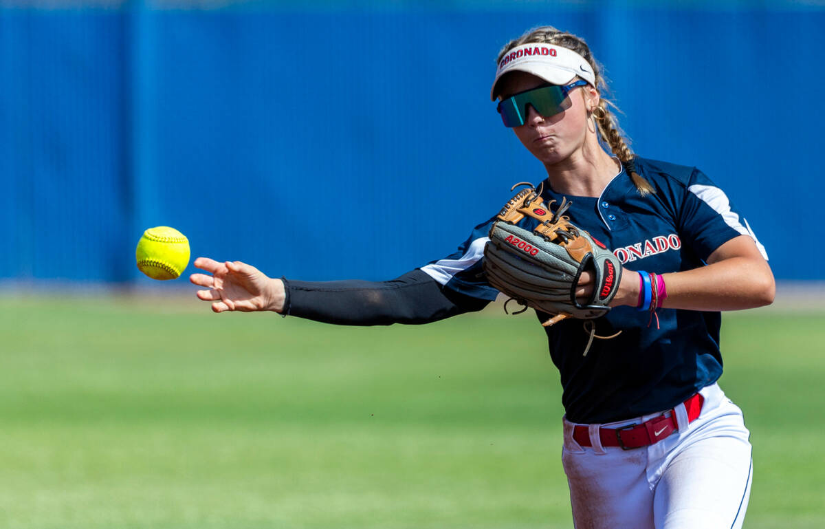 Coronado infielder Bailey Goldberg (1) throws to first base against a Douglas runner during the ...