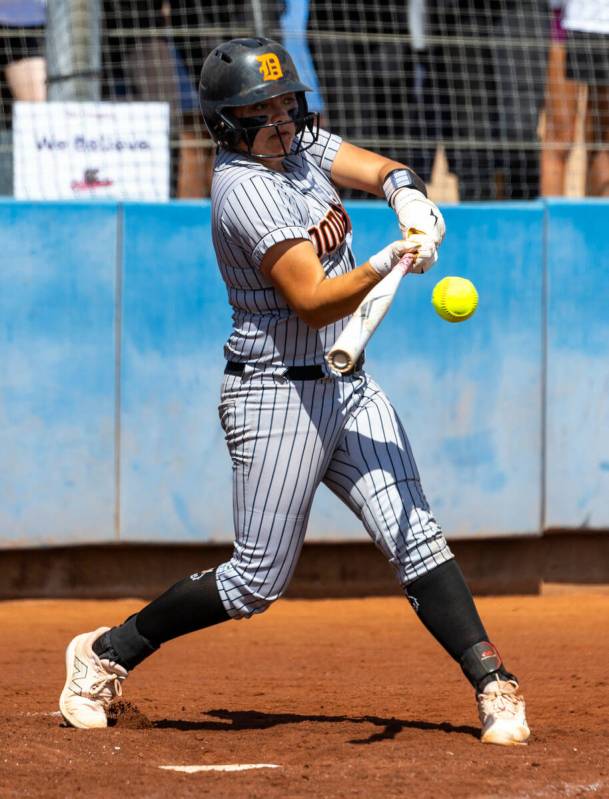 Douglas batter Zora Simpson (11) drives the ball against Coronado during the seventh inning of ...