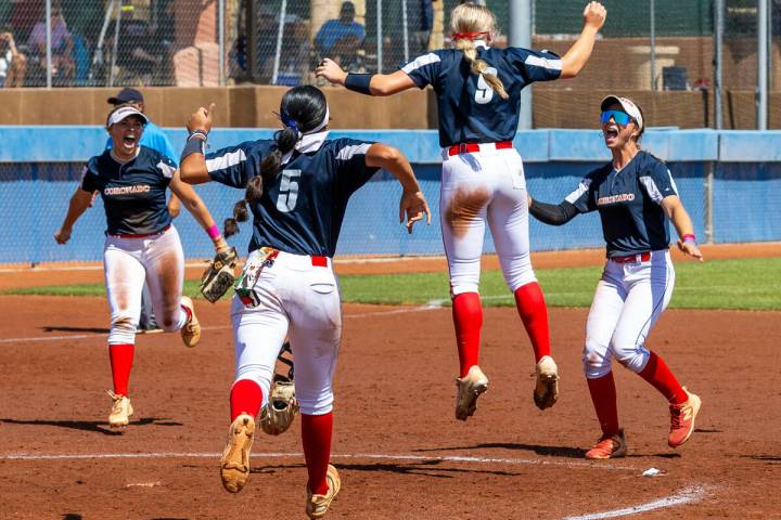 Coronado players celebrate their win over Douglas 4-2 during their 5A softball state tournament ...