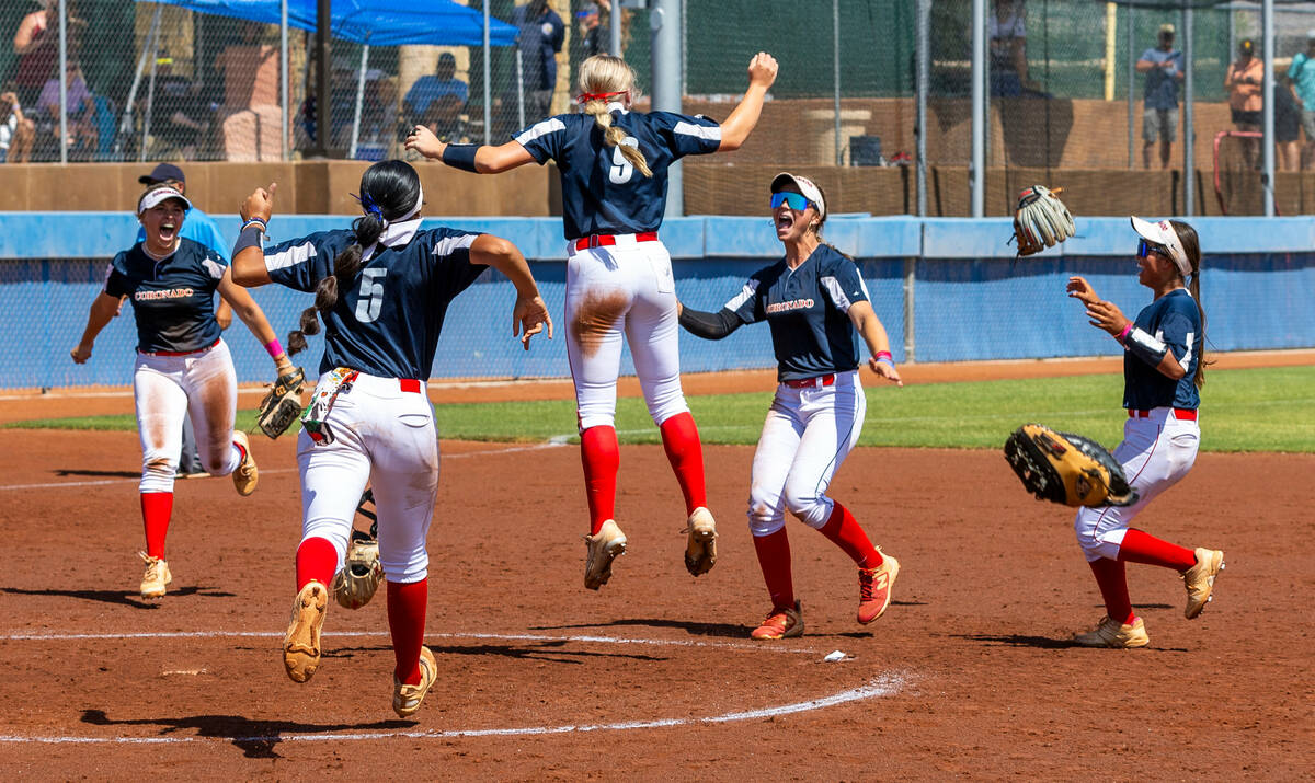 Coronado players celebrate their win over Douglas 4-2 during their 5A softball state tournament ...