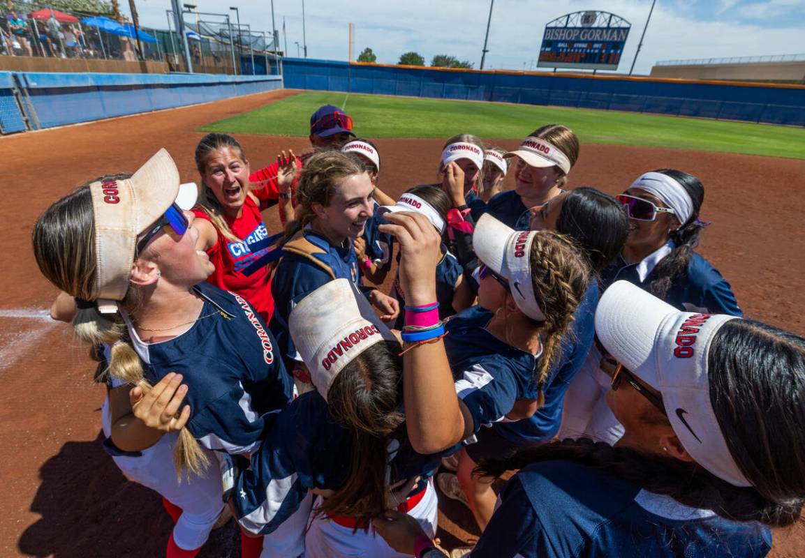 Coronado players celebrate their win over Douglas 4-2 during their 5A softball state tournament ...