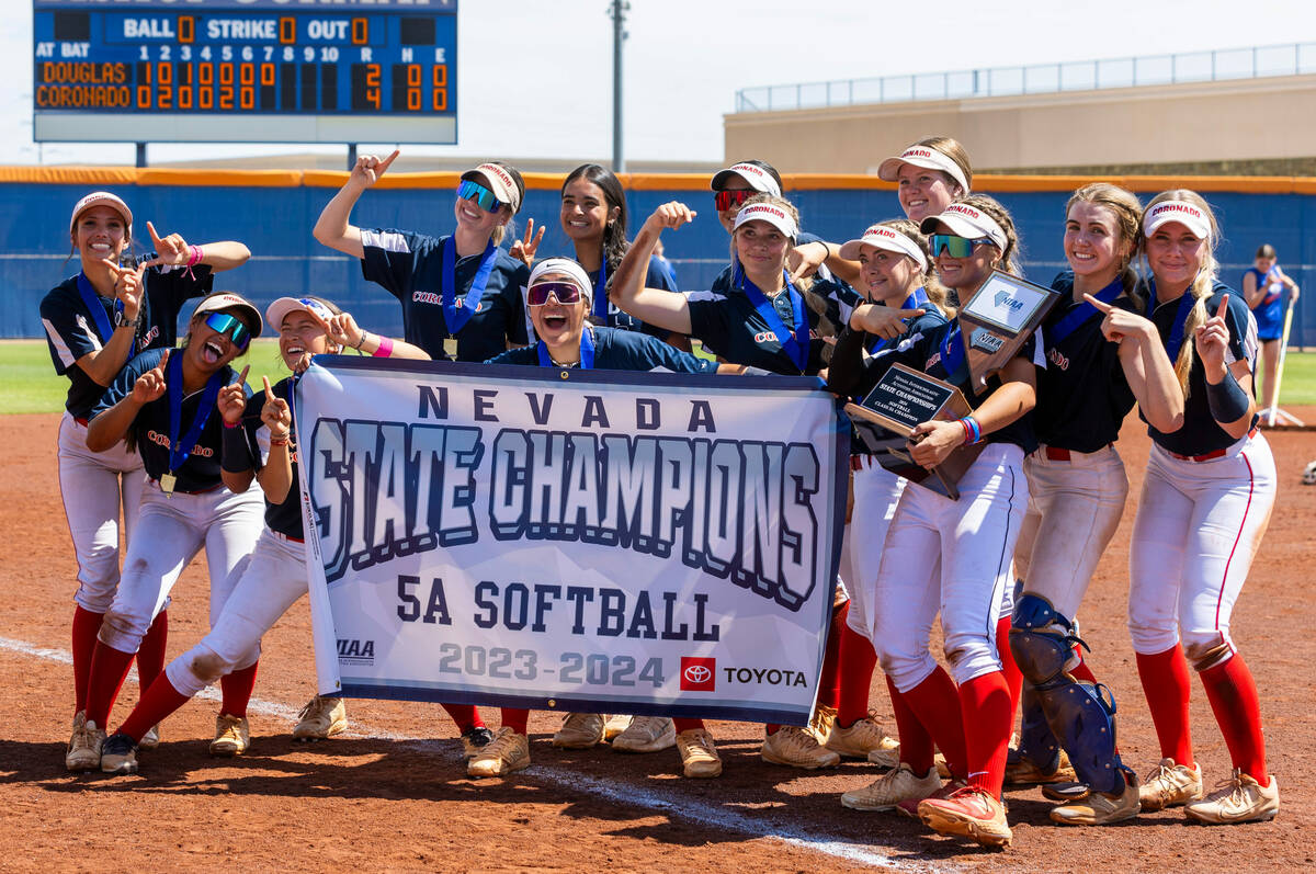 Coronado players celebrate their win over Douglas 4-2 during their 5A softball state tournament ...