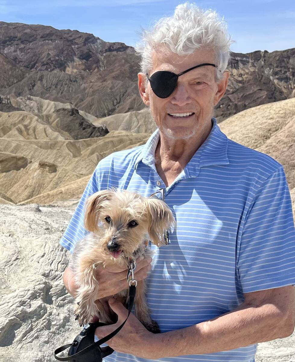 Former R-J columnist Norm Clarke is shown with his dog Scandal in Death Valley on April 8, 2023 ...