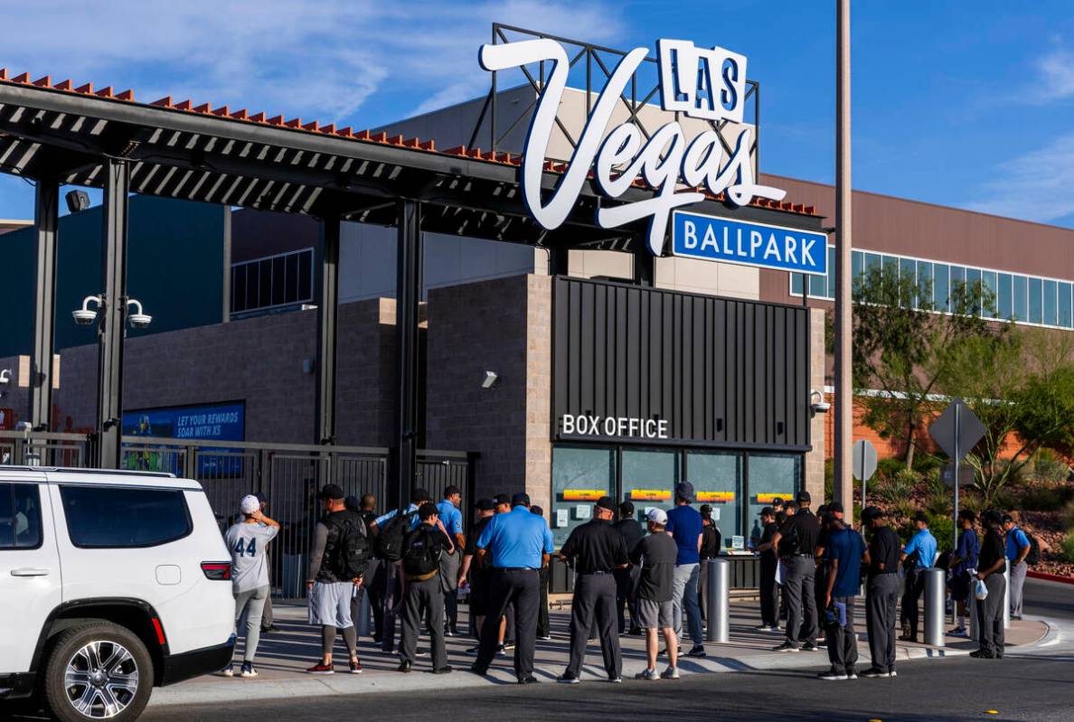 Participants line up to enter the Las Vegas Ballpark for a Major League camp for umpires on Sat ...