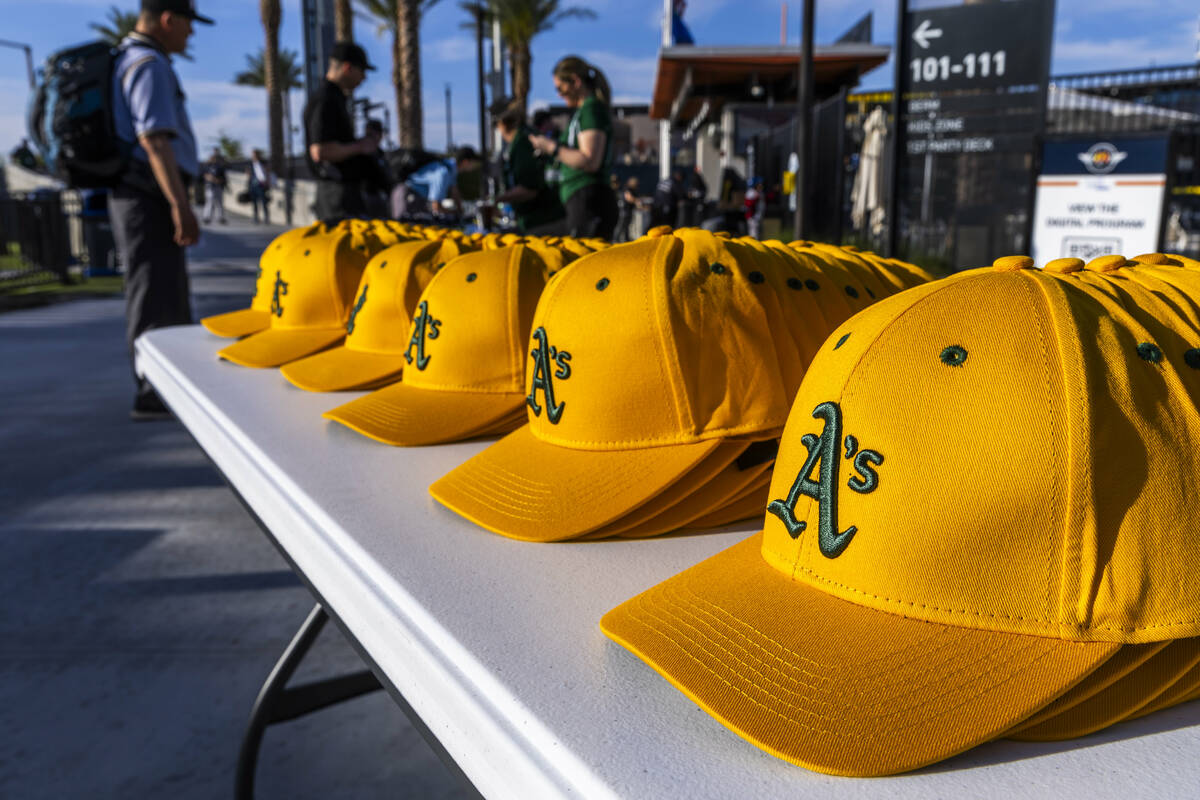 A stack of A's hats await as participants enter the Las Vegas Ballpark for a Major League camp ...