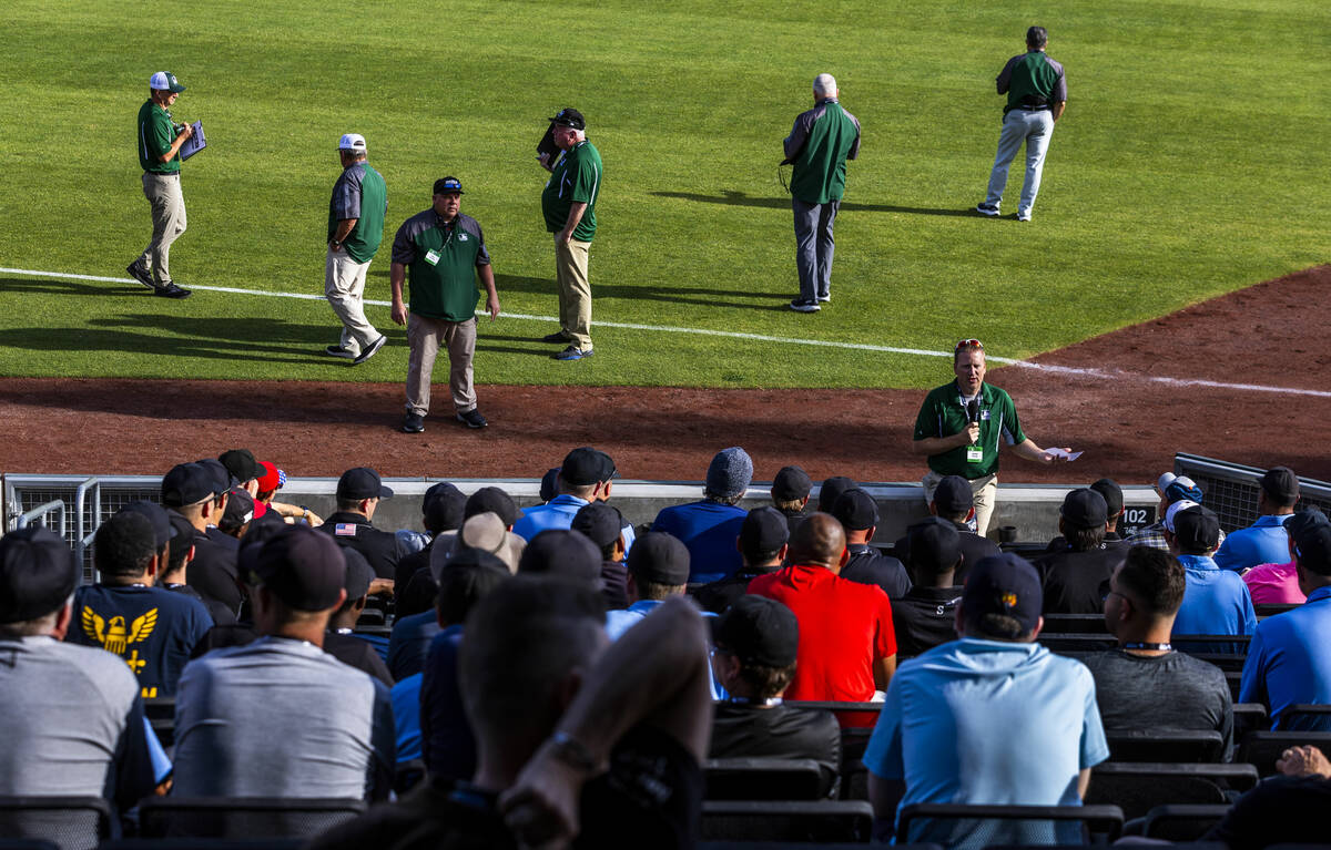 Staffers answer questions for participants during a Major League camp for umpires at the Las Ve ...