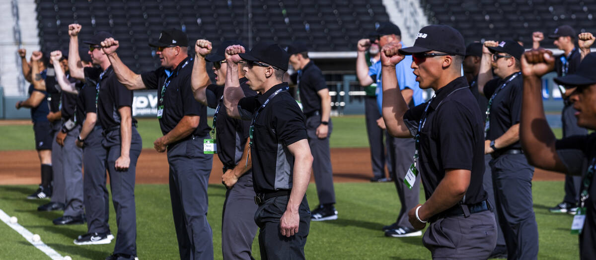 Participants practice their "out" calls during a Major League camp for umpires at the ...