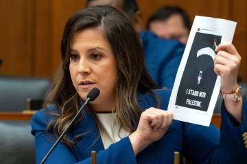 Rep. Elise Stefanik, R-N.Y., holds up a printout that she claims was from a New York City publi ...