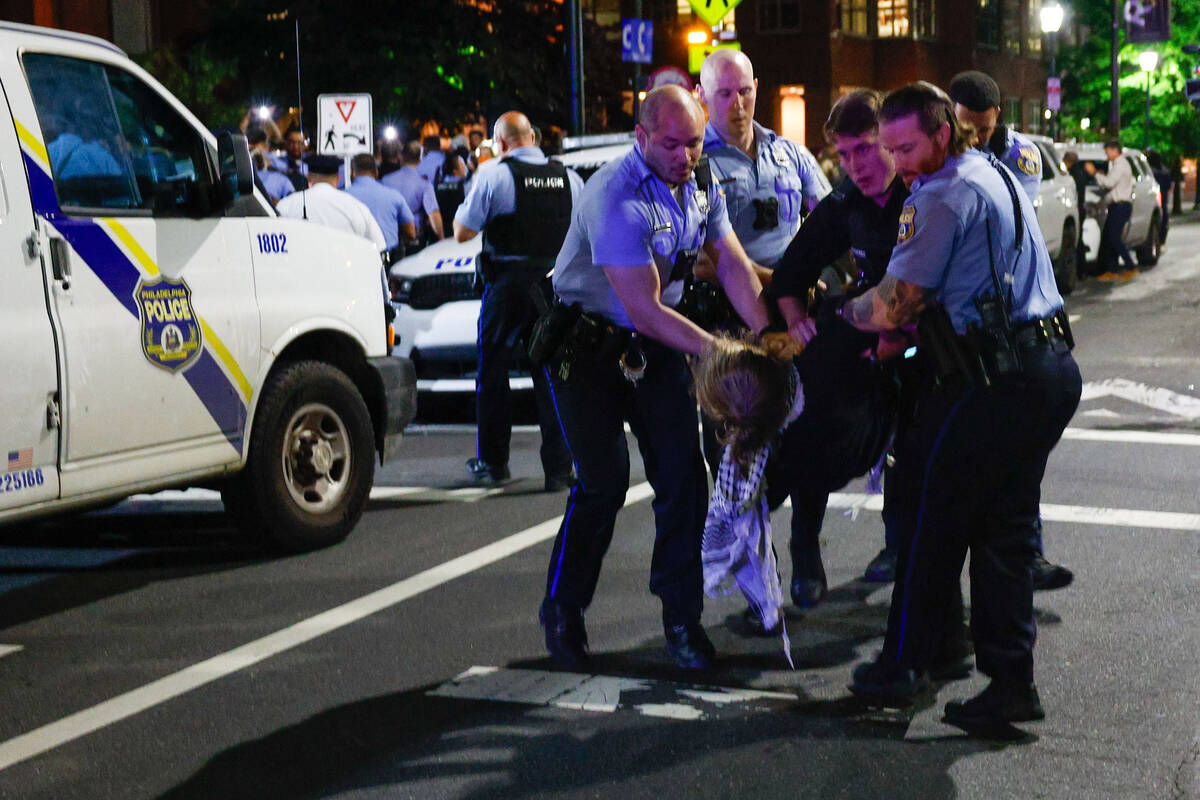 A protester with the Penn Gaza Solidarity Encampment being arrested on South 34th Street near t ...