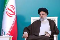 In this photo released by the Iranian Presidency Office, President Ebrahim Raisi attends a meet ...