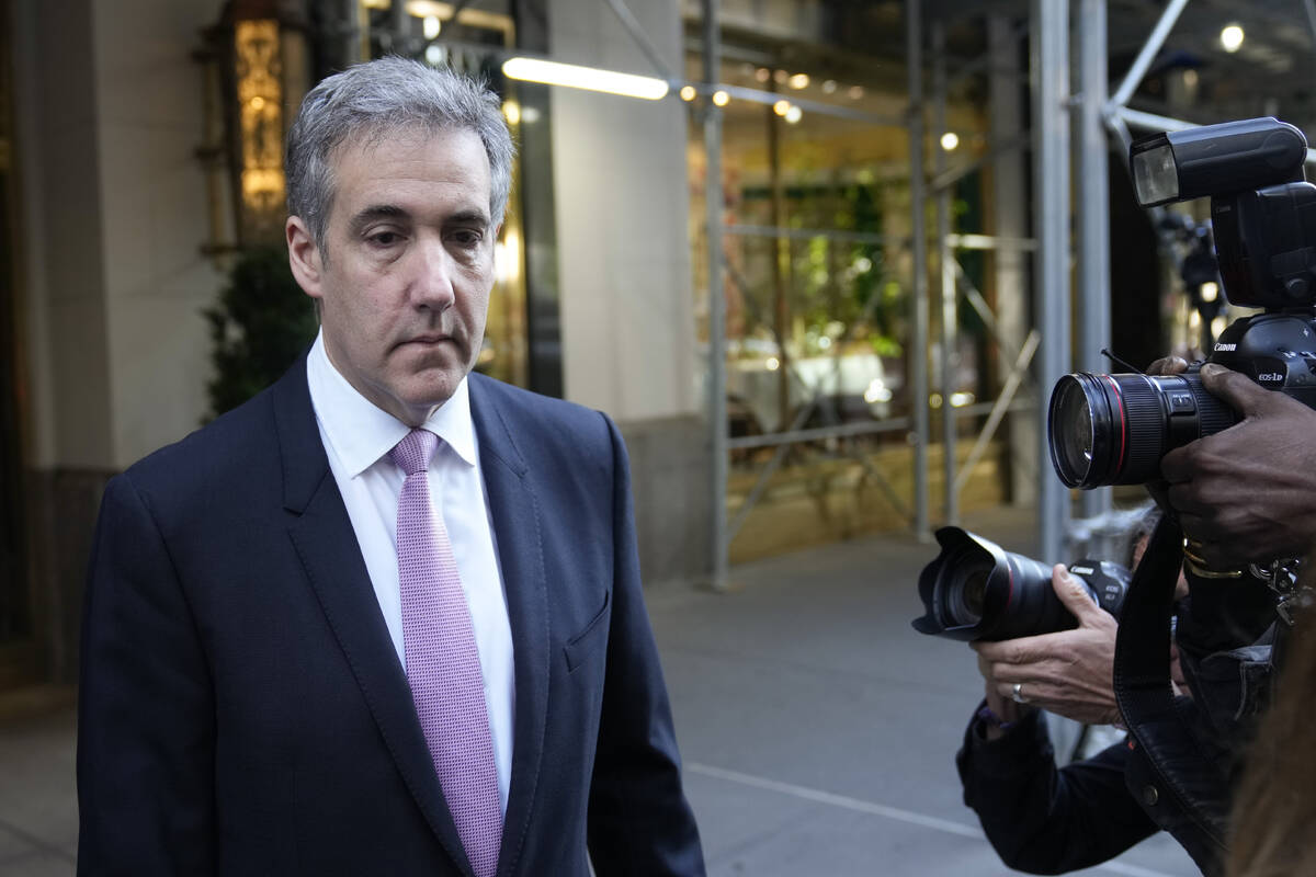 Michael Cohen leaves his apartment building on his way to Manhattan criminal court in New York, ...