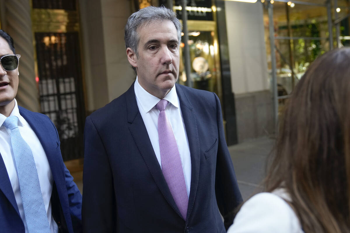 Michael Cohen leaves his apartment building on his way to Manhattan criminal court in New York, ...