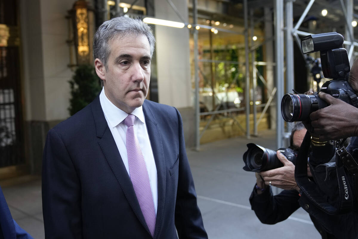 Michael Cohen leaves his apartment building on his way to Manhattan criminal court in New York, ...