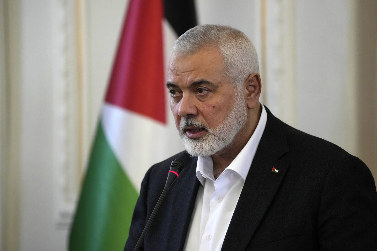 Hamas chief Ismail Haniyeh speaks during a press briefing after his meeting with Iranian Foreig ...