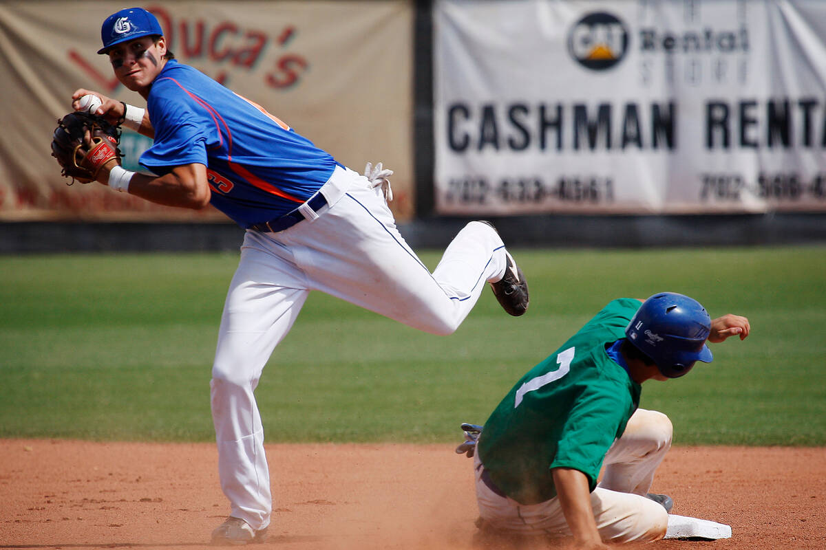 Bishop Gorman's Joey Gallo looks to turn a double play as Green Valley's Even Van Hoosier slide ...