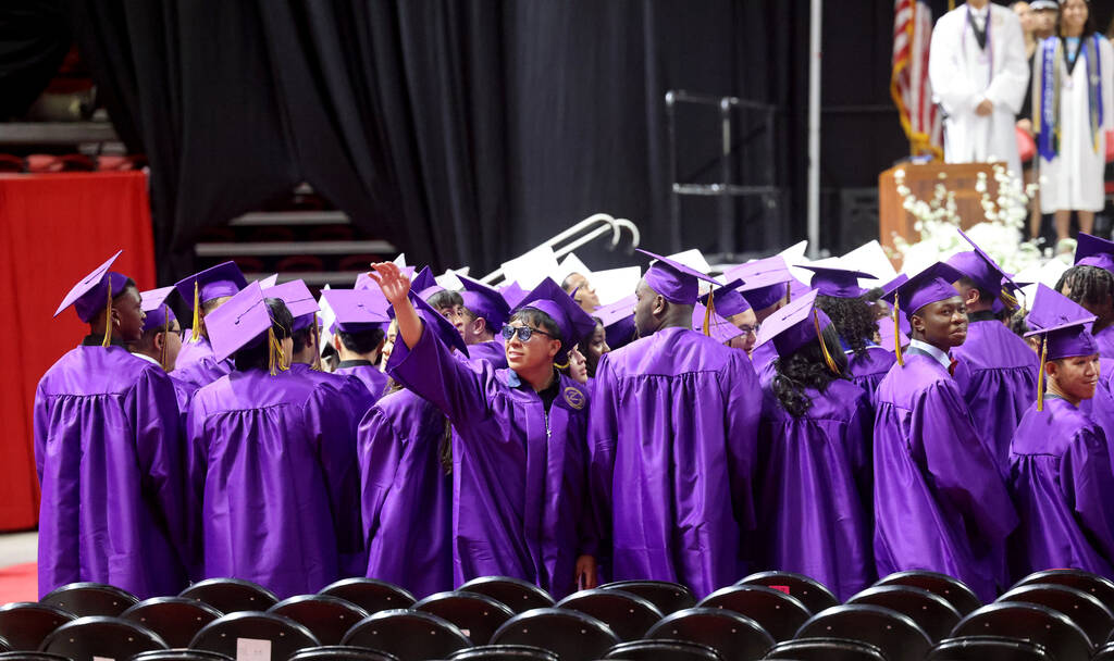 Durango High School students look for their families after the procession during graduation at ...