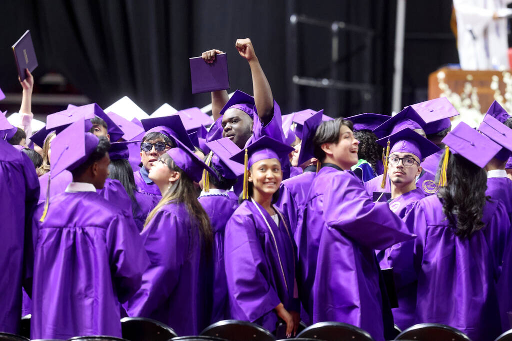 Durango High School students wave to their families after receiving their diplomas during gradu ...