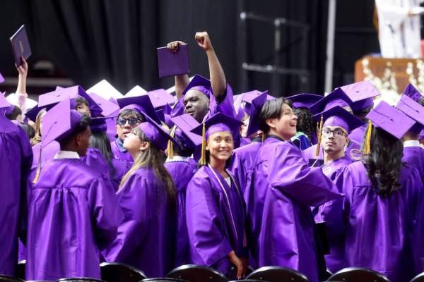 Durango High School students wave to their families after receiving their diplomas during gradu ...