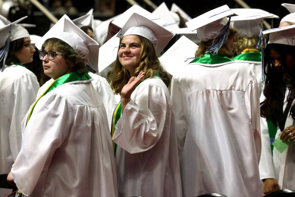 Green Valley High School students look for their families during the procession during graduati ...