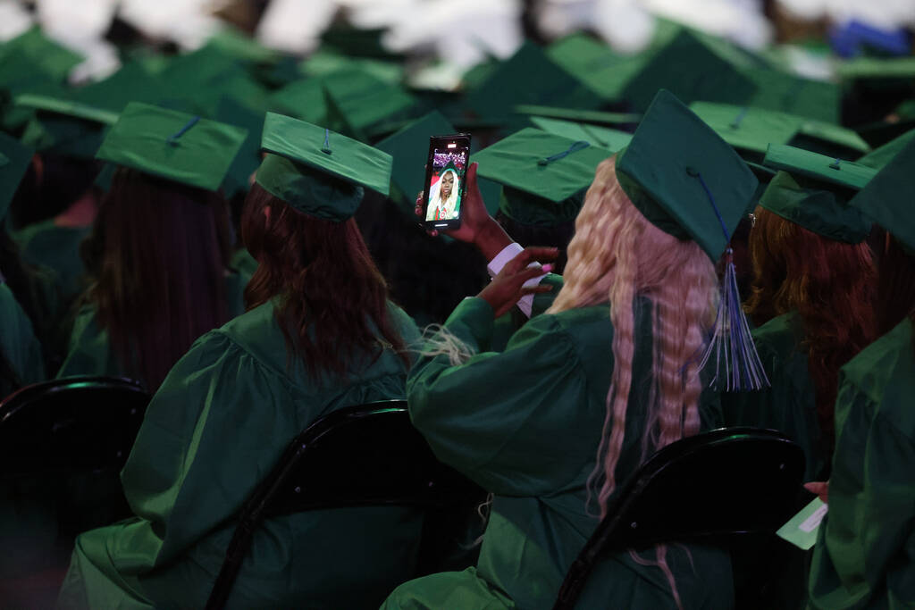 Green Valley High School students listen to a speaker during graduation at Thomas & Mack Ce ...