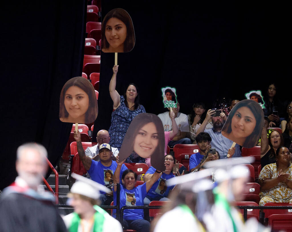 Families cheer on their Green Valley High School students in the procession during graduation a ...