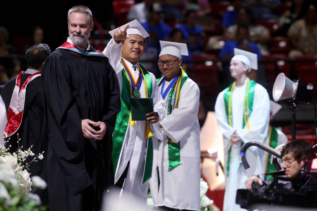 Green Valley High School students receive their diplomas during graduation at Thomas & Mack ...