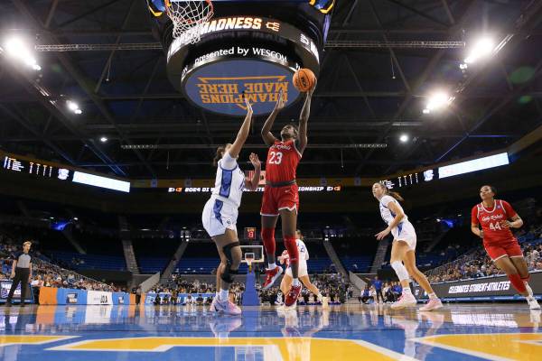 UNLV Lady Rebels center Desi-Rae Young (23) shoots against Creighton Bluejays guard Jayme Horan ...