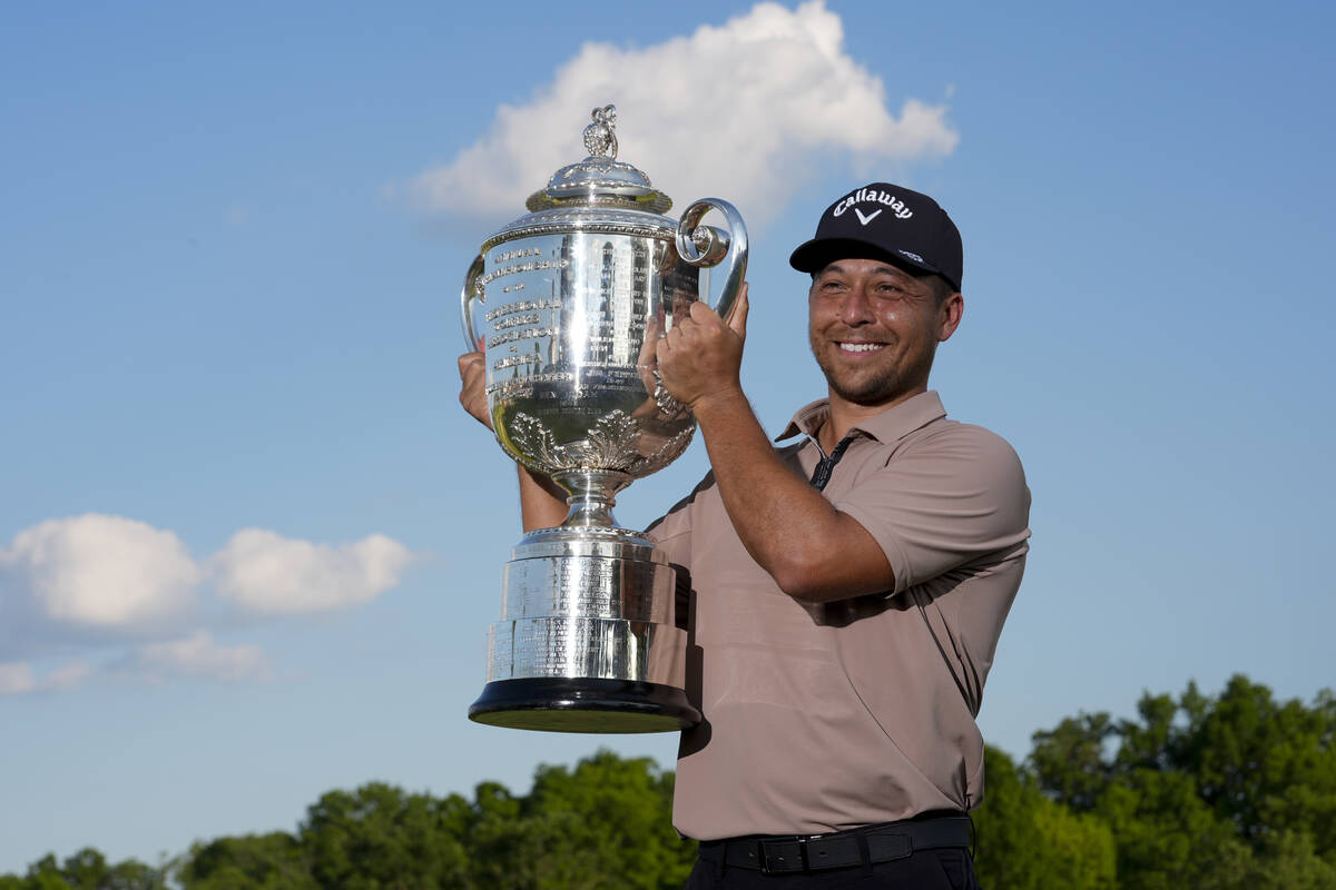 Xander Schauffele holds the Wanamaker trophy after winning the PGA Championship golf tournament ...