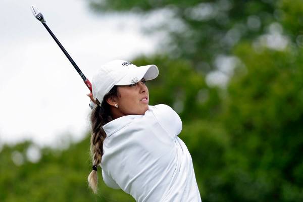 Yana Wilson watches her tee shot on the second hole during the first round of the Mizuho Americ ...