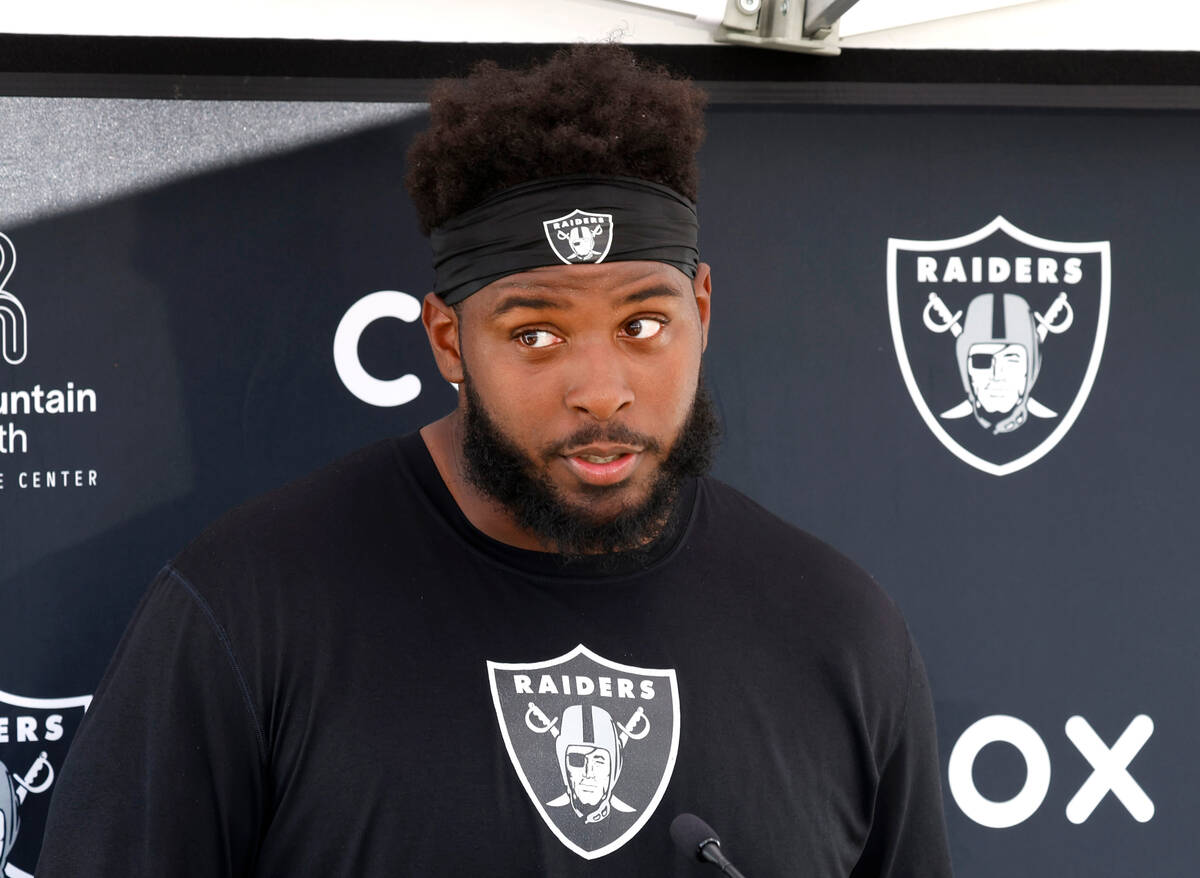Raiders offensive tackle Thayer Munford Jr. listens to reporters questions as he addresses the ...