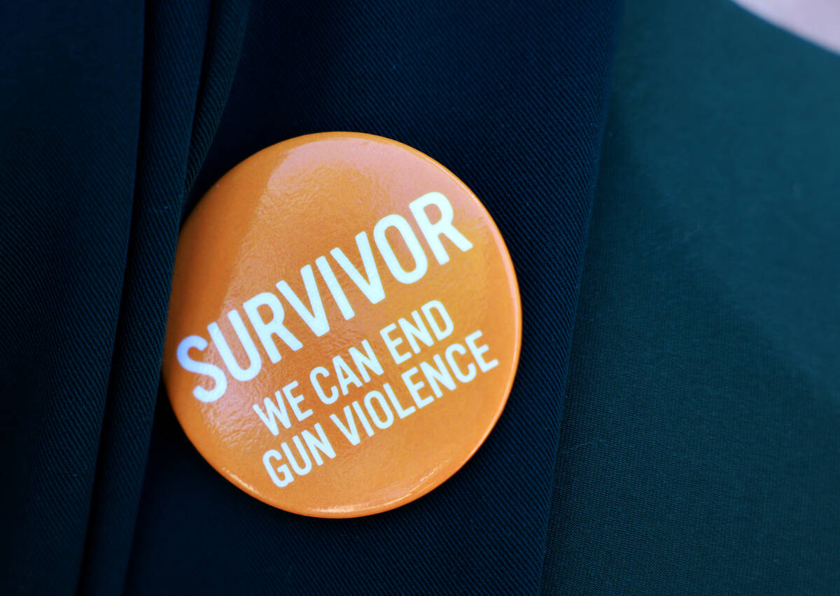 Zena Hajji, who was in the Student Union during the UNLV shooting, dons a button during a press ...