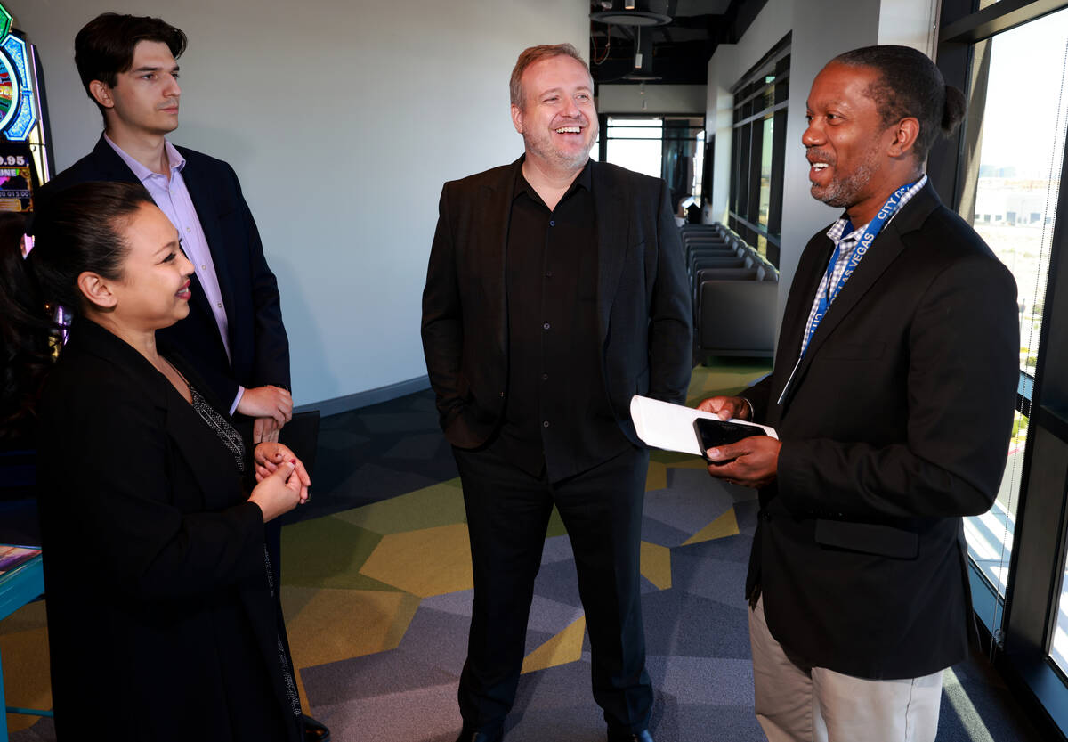 Rafael Kartaszynski, CEO and founder of VisionariesNV, second from right, mingles with, from le ...