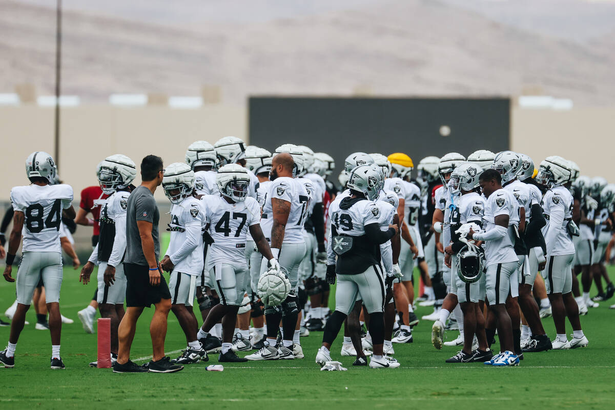 Raiders players get ready to stretch during training camp at the Intermountain Health Performan ...
